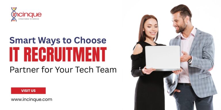A professional man and woman discussing tech talent solutions over a laptop screen.